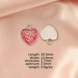 Polished stainless steel heart pendant with red resin inlay and dimensions guide