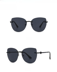Detailed front and side views of vintage black cat-eye sunglasses with thin metal legs