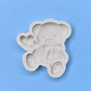 Cute teddy bear silicone mold with heart and bow details for DIY crafts and baking