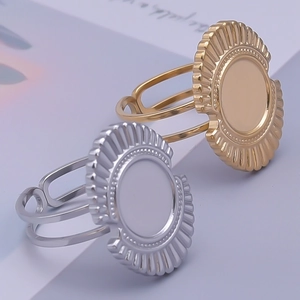 Detailed macro view of adjustable round sunflower bezel ring bases in gold and silver