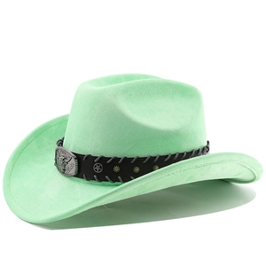 Detail of mint green western cowboy hat featuring a silver bull head buckle and studs