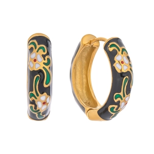 Detail of gold-plated hoop earrings with floral enamel patterns on a white background
