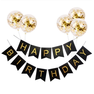 Birthday party set with black gold banner and clear balloons with gold sequins