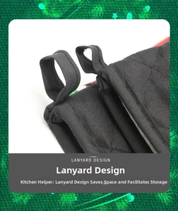 Detail of black quilted heat resistant oven mitt featuring a sturdy lanyard for hanging