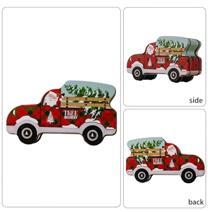 Detail view showing side and back angles of a Christmas truck shaped tin candy box