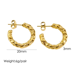 Detailed view of 14K gold plated C-hoop earrings featuring textured hammered finish