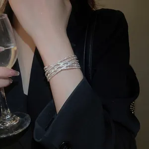 Elegant multi-layer crossover silver bracelet with sparkling pavé crystals for women