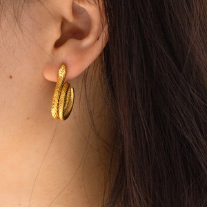 Elegant 18K gold-plated stainless steel snake earrings worn for a luxury jewelry look