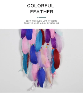 Detailed close-up of colorful feathers and lace ribbons of the unicorn dreamcatcher