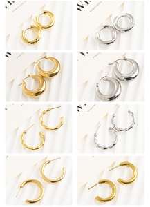 Collection of polished gold and silver hoop earrings featuring bamboo and teardrop designs