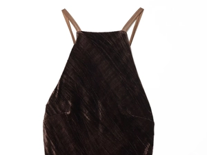 Detailed view of dark brown velvet fabric texture with fine diagonal stripes and thin straps