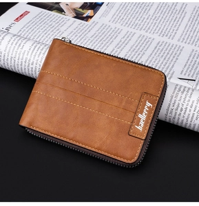 Detailed macro view of a brown PU leather wallet with zipper closure and embossed logo