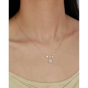 Close-up of elegant S925 silver necklace with pear-shaped water drop pendant on neck