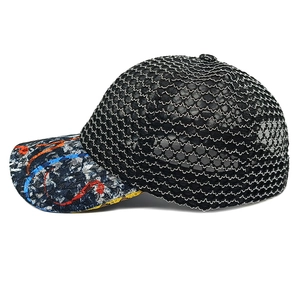 Close-up of black mesh breathable baseball cap featuring vibrant graffiti pattern on the brim