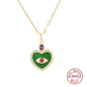 S925 sterling silver heart necklace featuring green enamel evil eye and purple gemstone