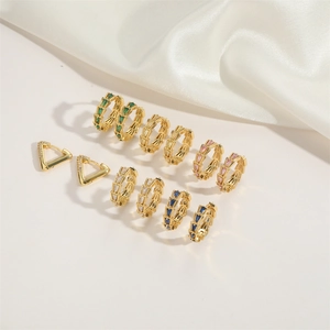 French retro gold earrings set with baguette-cut crystals and geometric triangle shapes