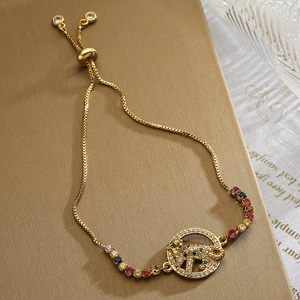 Adjustable gold leopard charm bracelet with multicolor zircon stones and slide clasp