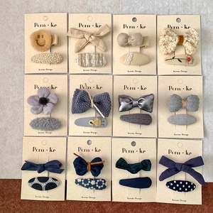 12-set Korean style fabric bow hairpins featuring plaid patterns and smiley face charms