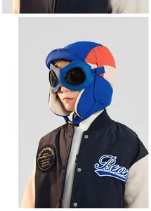 Close-up of kids winter aviator hat with goggles and warm lamb wool lining