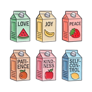 Set of six colorful milk carton metal pins with fruit patterns and positive text