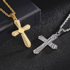 Detailed view of silver and gold titanium steel cross pendants on twisted rope chains