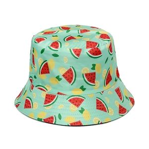 Close-up of watermelon and lemon print on green cotton bucket hat with stitched brim