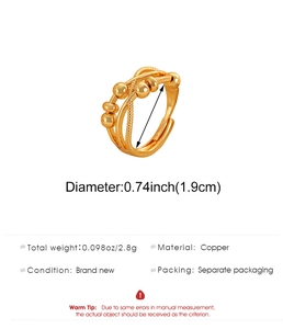 Detail view of gold multi-layer rotatable spinner ring with copper material specs