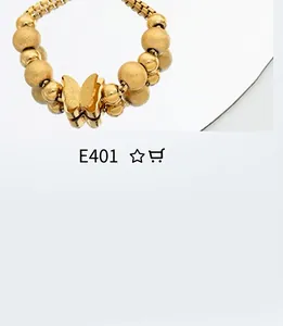 Detailed close-up of golden beaded bracelet featuring a delicate butterfly pendant