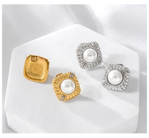 Macro view of gold and silver square pearl earrings with micro-inlaid rhinestones