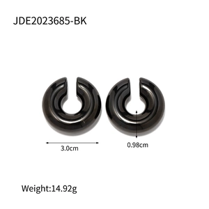 Detail view of black hollow tube hoop earrings with 3.0cm diameter and 0.98cm thickness