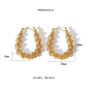 Detail showing 33mm gold-plated spiral earrings with dimensions and 6g weight details
