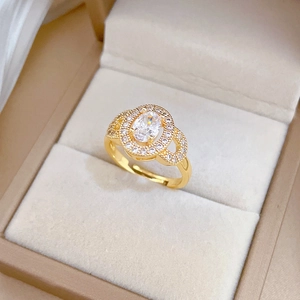 Luxurious egg-shaped gold open ring with large oval zircon and micro-pave diamond accents