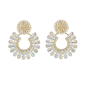 Elegant gold fan-shaped stud earrings with sparkling baguette zircons in a radial design