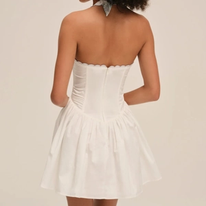 White French halter backless mini dress with embroidered bodice and puffy skirt