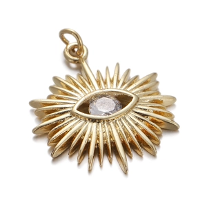 Detailed view of a golden sun-eye pendant with sparkling central zircon and round hoop