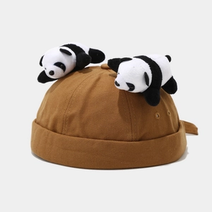 Detail of brown canvas docker hat featuring creative 3D panda plush decorations