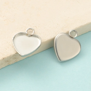 Detailed view of heart-shaped stainless steel pendant trays with a polished silver finish