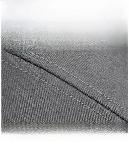 Macro detail of high-quality double stitching on the durable twill fabric of this cap