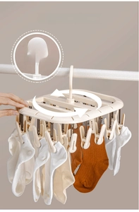 Close-up of a 360-degree rotating drying rack with 24 clips for hanging socks