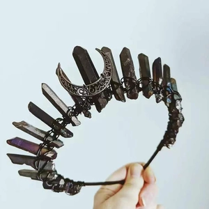 Close-up of handmade Wicca moon crown with dark crystals and black wire wrapping