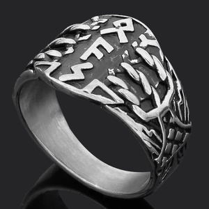 Macro shot of Viking Thor's Hammer ring with Rune engravings and silver-black finish