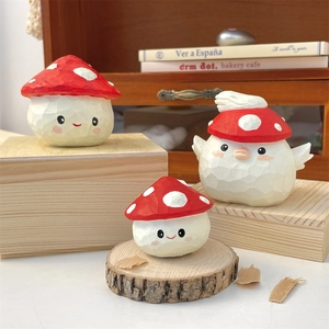 Detailed view of 3-piece mushroom figurine set with rustic wood-carved texture