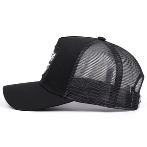Detail of breathable mesh fabric and adjustable snap closure on black trucker hat