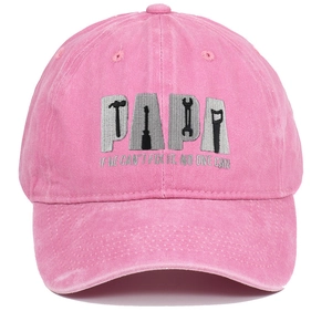 Close-up of PAPA tool embroidery on pink washed cotton baseball cap with repair slogan
