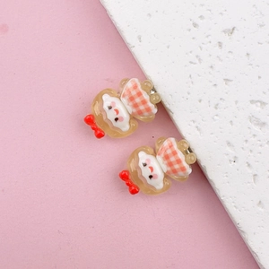 Detailed macro view of cute cartoon girl hair clips with pink checkered patterns