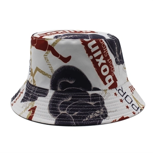 Macro shot of boxing themed bucket hat featuring tropical patterns and sports graphics