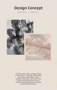 Detail of 925 sterling silver nugget necklace with round pearl and irregular metal facets
