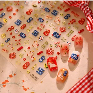 Macro view of Lunar New Year nail stickers featuring red dragon and lucky koi patterns
