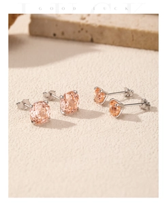 Macro shot of S925 silver stud earrings set with champagne round-cut crystals in two sizes