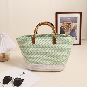 Large woven cotton tote bag with bamboo handles and green geometric patterns